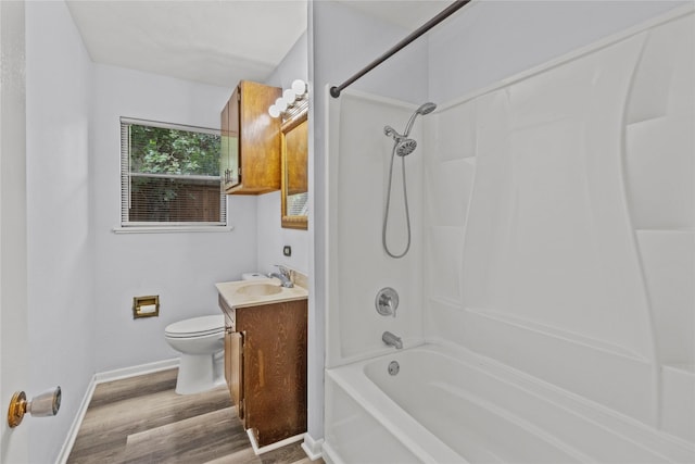 514 E Foley St, Alvin, TX 77511 - full bathroom featuring vanity, tub / shower combination, and wood finished floors