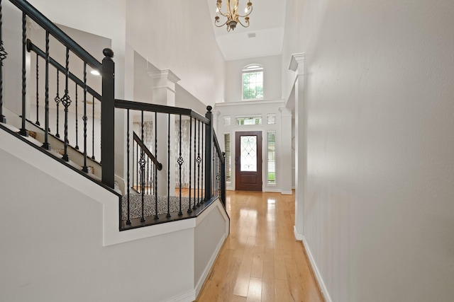 14210 Northface Manor Ct, Cypress, TX 77429 - entryway with a towering ceiling, a chandelier, wood-type flooring, and stairway