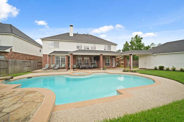 14210 Northface Manor Ct, Cypress, TX 77429 - view of swimming pool featuring a patio, a fenced backyard, and a pool with connected hot tub
