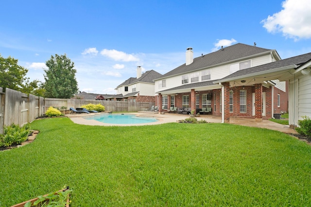14210 Northface Manor Ct, Cypress, TX 77429 - rear view of house featuring a fenced backyard, brick siding, a patio area, and a shingled roof