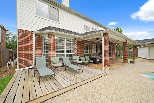 14210 Northface Manor Ct, Cypress, TX 77429 - rear view of property with brick siding, an outdoor living space, a wooden deck, a patio, and a chimney