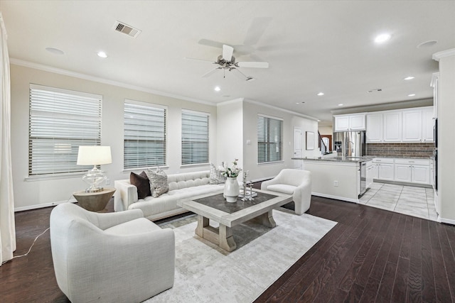 831 W 26th St, Houston, TX 77008 - living area featuring crown molding, ceiling fan, recessed lighting, and light wood-style floors