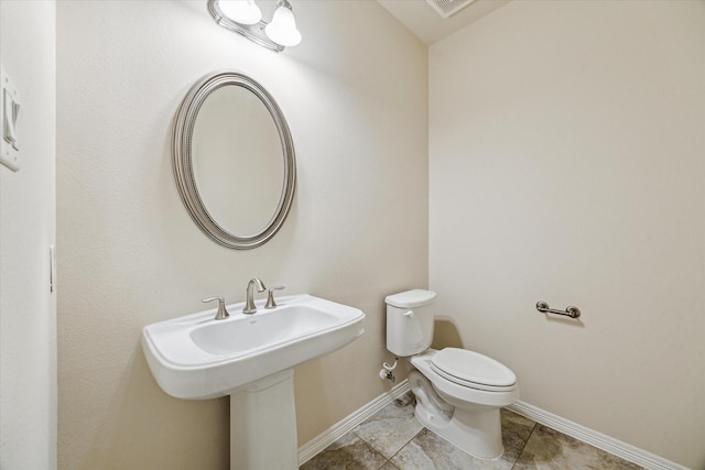 831 W 26th St, Houston, TX 77008 - bathroom featuring toilet and tile patterned floors