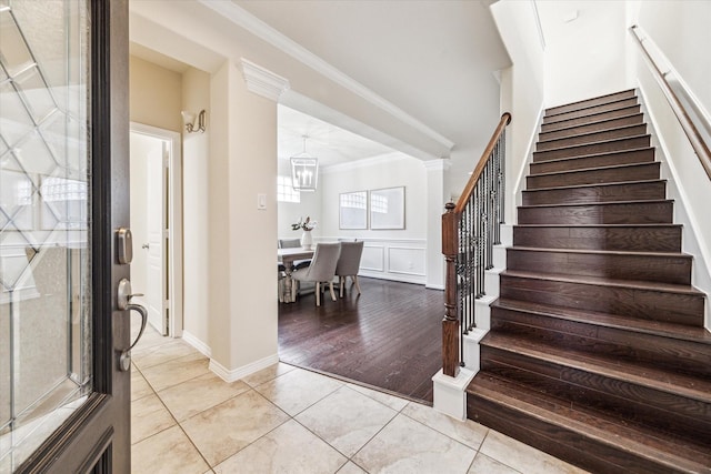 831 W 26th St, Houston, TX 77008 - foyer with stairway, ornamental molding, light tile patterned floors, and a chandelier