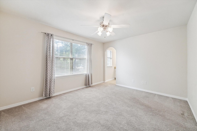 831 W 26th St, Houston, TX 77008 - carpeted spare room with ceiling fan and arched walkways