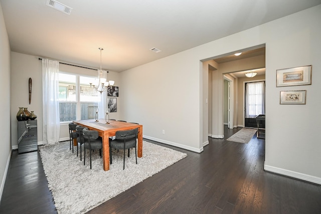 24311 Orley Island Ct, Katy, TX 77493 - dining space with a chandelier, plenty of natural light, and dark wood-type flooring