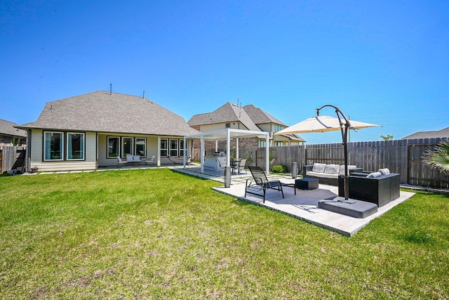 24311 Orley Island Ct, Katy, TX 77493 - rear view of house with an outdoor hangout area, a fenced backyard, and a patio area