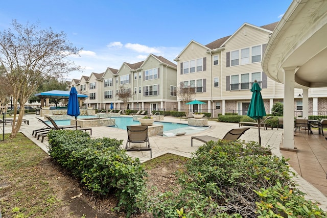 3001 Murworth Dr Unit 1606, Houston, TX 77025 - community pool featuring a jacuzzi, a patio, and a residential view