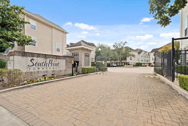 3001 Murworth Dr Unit 1606, Houston, TX 77025 - view of decorative road featuring a gated entry, a residential view, street lighting, and curbs