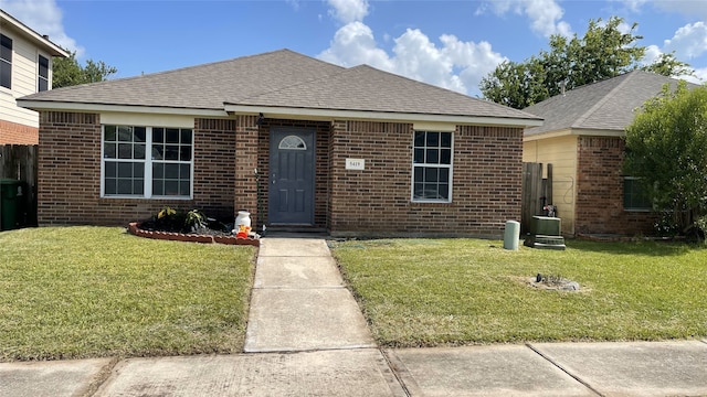 5419 Quail Cove Ln, Houston, TX 77053 - view of front facade featuring brick siding, a front lawn, and roof with shingles