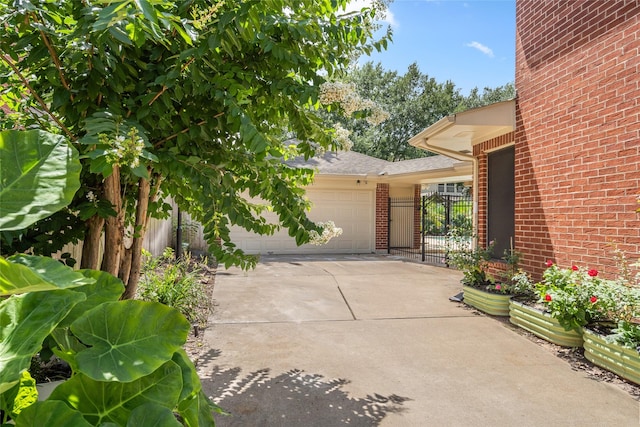 7943 Scenic Canyon Ln, Houston, TX 77095 - view of property exterior with brick siding, concrete driveway, and an attached garage