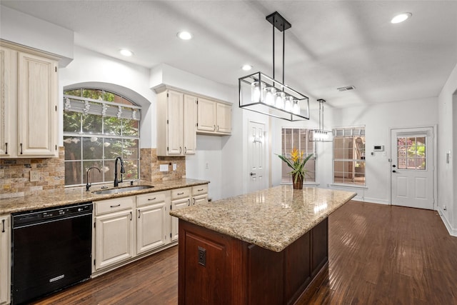 7943 Scenic Canyon Ln, Houston, TX 77095 - kitchen with black dishwasher, dark wood finished floors, tasteful backsplash, light stone countertops, and recessed lighting