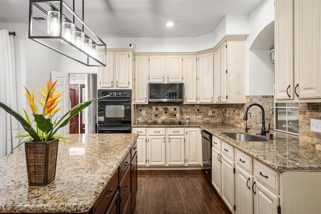 7943 Scenic Canyon Ln, Houston, TX 77095 - kitchen featuring black appliances, dark wood finished floors, light stone counters, decorative backsplash, and pendant lighting