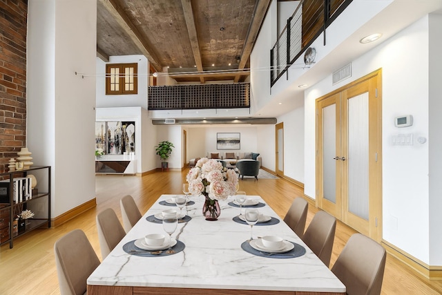 915 Franklin St Unit 9L, Houston, TX 77002 - dining room featuring a high ceiling and light wood finished floors