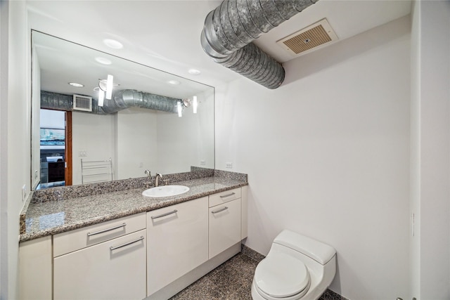 915 Franklin St Unit 9L, Houston, TX 77002 - half bathroom featuring vanity and recessed lighting