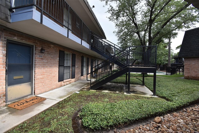 9007 Gaylord St Unit 23, Houston, TX 77024 - view of grassy yard featuring stairs and a patio