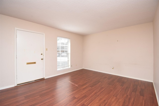 9007 Gaylord St Unit 23, Houston, TX 77024 - spare room with dark wood finished floors and baseboards