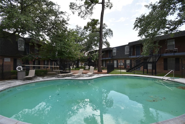 9007 Gaylord St Unit 23, Houston, TX 77024 - view of pool featuring stairway