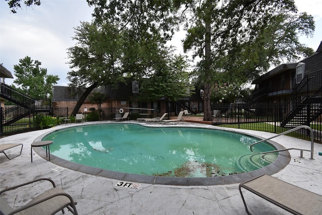 9007 Gaylord St Unit 23, Houston, TX 77024 - community pool featuring stairs and a patio area