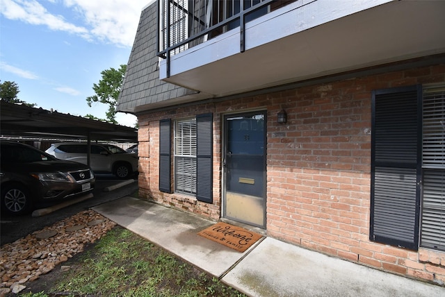 9007 Gaylord St Unit 23, Houston, TX 77024 - entrance to property featuring brick siding and a balcony