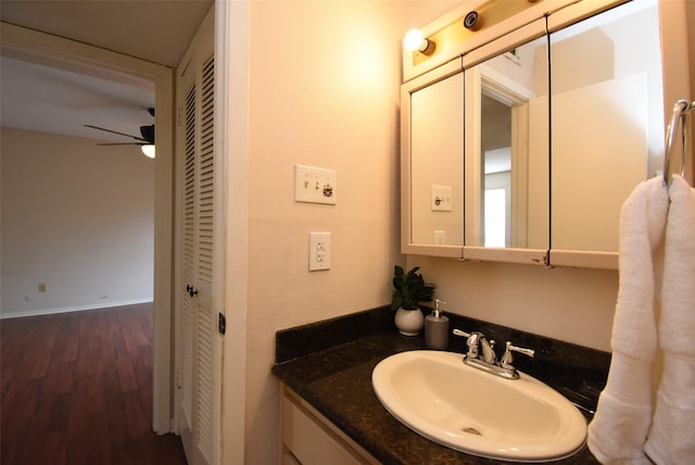 9007 Gaylord St Unit 23, Houston, TX 77024 - bathroom with ceiling fan, a closet, vanity, and wood finished floors