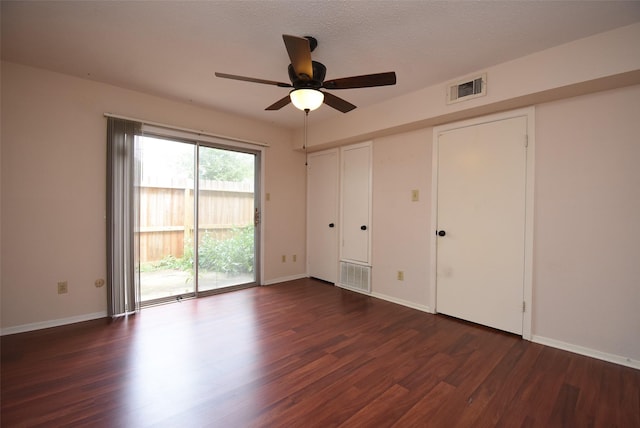 9007 Gaylord St Unit 23, Houston, TX 77024 - unfurnished bedroom featuring access to exterior, wood finished floors, and a ceiling fan