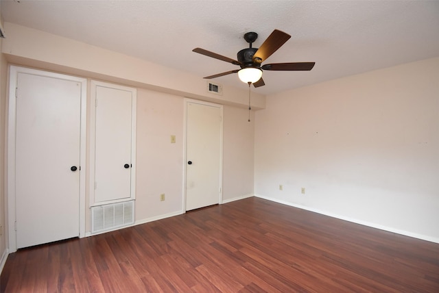 9007 Gaylord St Unit 23, Houston, TX 77024 - unfurnished bedroom featuring wood finished floors, a ceiling fan, and a closet