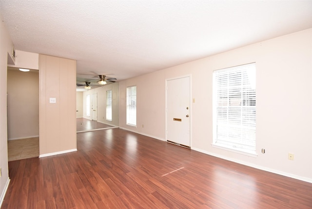 9007 Gaylord St Unit 23, Houston, TX 77024 - unfurnished living room with wood finished floors and a ceiling fan