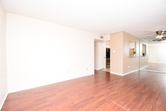 9007 Gaylord St Unit 23, Houston, TX 77024 - spare room featuring wood finished floors and ceiling fan