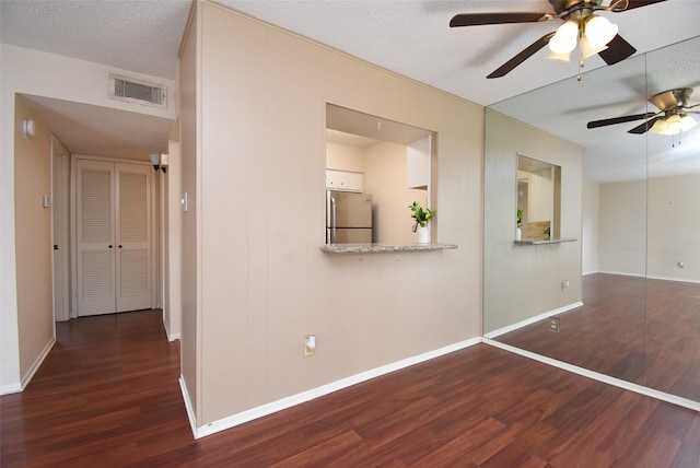 9007 Gaylord St Unit 23, Houston, TX 77024 - hallway featuring wood finished floors and a textured ceiling