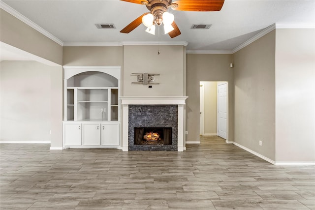 110 Rustling Wind Dr, Montgomery, TX 77356 - unfurnished living room featuring a ceiling fan, crown molding, a tile fireplace, and light wood finished floors