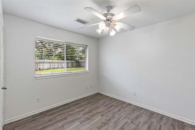 110 Rustling Wind Dr, Montgomery, TX 77356 - empty room with wood finished floors and ceiling fan