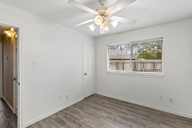 110 Rustling Wind Dr, Montgomery, TX 77356 - unfurnished bedroom with wood finished floors and a ceiling fan