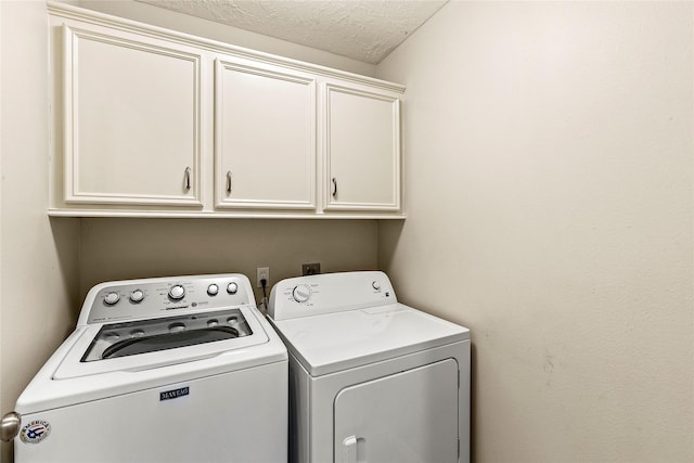 110 Rustling Wind Dr, Montgomery, TX 77356 - laundry room with cabinet space, separate washer and dryer, and a textured ceiling