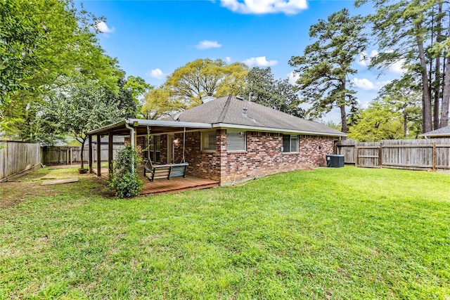110 Rustling Wind Dr, Montgomery, TX 77356 - back of house featuring a wooden deck, a fenced backyard, brick siding, roof with shingles, and a chimney