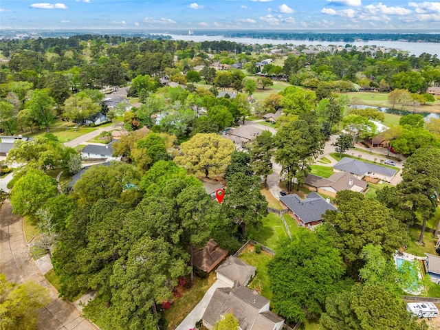 110 Rustling Wind Dr, Montgomery, TX 77356 - aerial view of residential area featuring a large body of water and a tree filled landscape