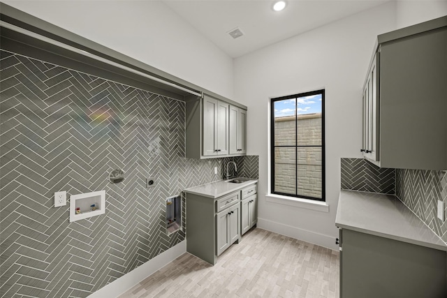 431 W 30th St, Houston, TX 77018 - laundry area featuring cabinet space, hookup for an electric dryer, hookup for a washing machine, recessed lighting, and light wood-type flooring
