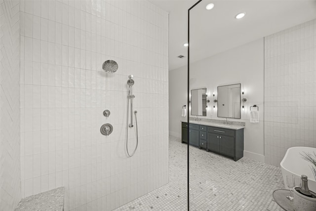 431 W 30th St, Houston, TX 77018 - bathroom featuring a walk in shower, double vanity, a freestanding tub, and recessed lighting