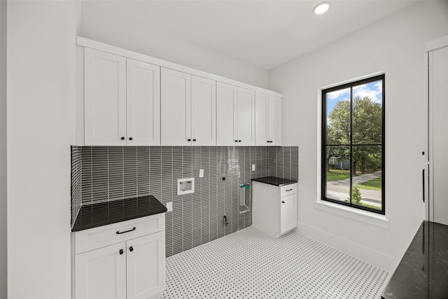 431 W 30th St, Houston, TX 77018 - laundry area with cabinet space, electric dryer hookup, and hookup for a washing machine