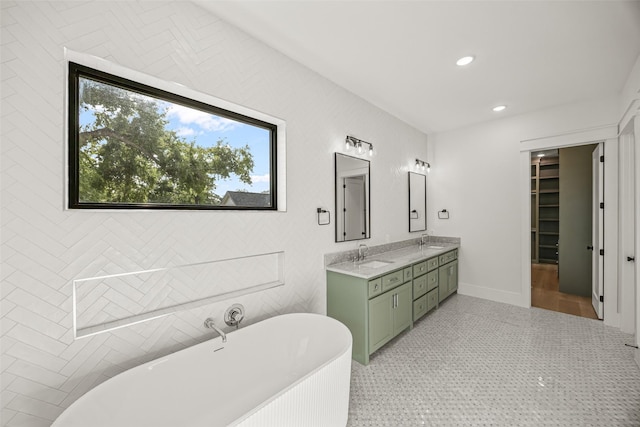 431 W 30th St, Houston, TX 77018 - bathroom featuring double vanity, a freestanding bath, and recessed lighting