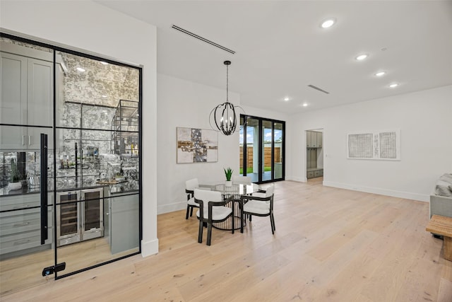 431 W 30th St, Houston, TX 77018 - dining area with light wood finished floors, a chandelier, and recessed lighting