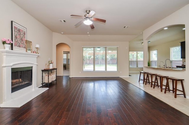 4327 Estes Ridge Ln, Katy, TX 77493 - living area with ceiling fan, arched walkways, and hardwood / wood-style floors