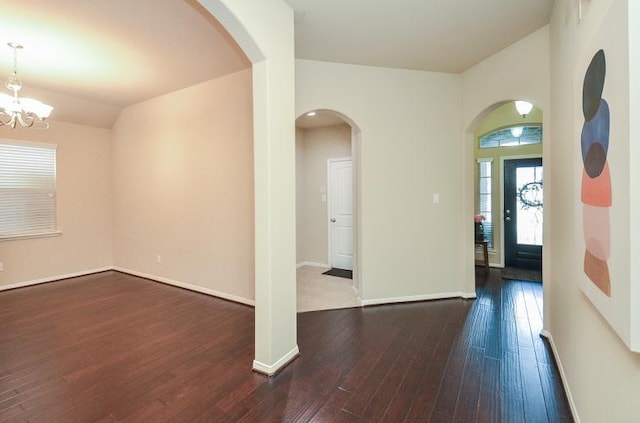 4327 Estes Ridge Ln, Katy, TX 77493 - entryway with dark wood-style flooring, arched walkways, and a chandelier