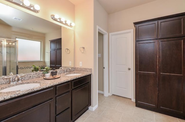 4327 Estes Ridge Ln, Katy, TX 77493 - full bath with double vanity, a shower stall, and tile patterned floors