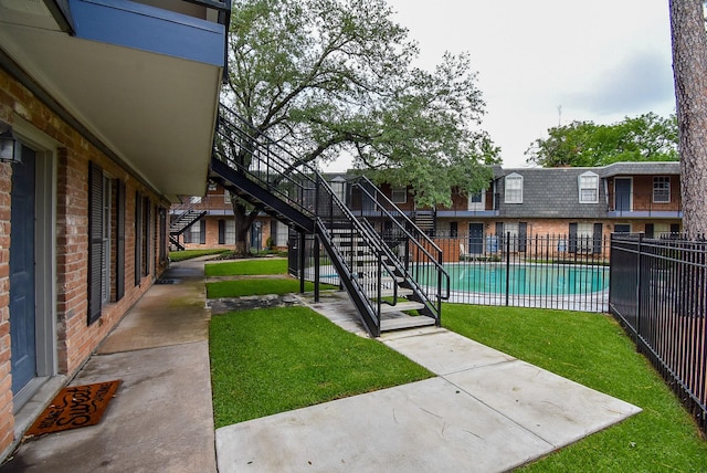 9005 Gaylord St Unit 19, Houston, TX 77024 - community pool with a patio and stairway