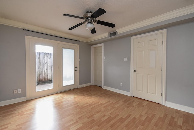 9005 Gaylord St Unit 19, Houston, TX 77024 - spare room featuring light wood finished floors, ceiling fan, and crown molding