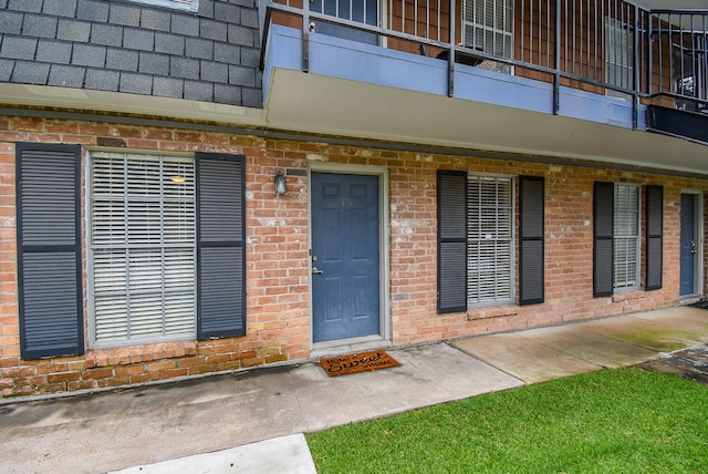 9005 Gaylord St Unit 19, Houston, TX 77024 - view of exterior entry featuring brick siding