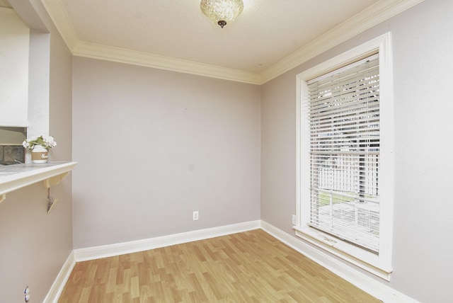 9005 Gaylord St Unit 19, Houston, TX 77024 - unfurnished dining area with light wood finished floors and ornamental molding