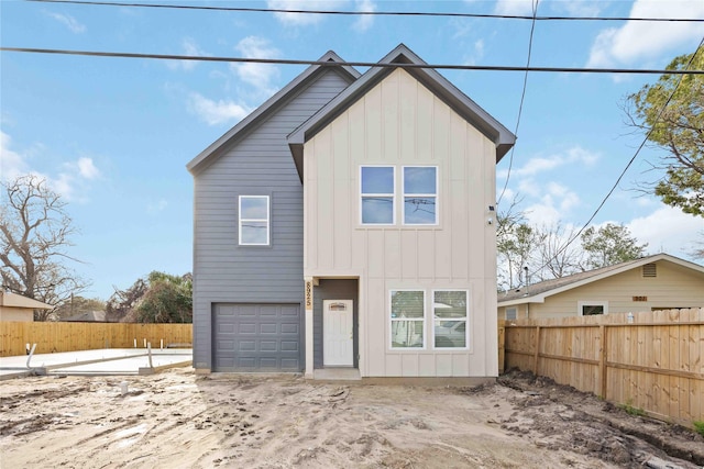 8923 De Priest St, Houston, TX 77088 - view of front of property featuring board and batten siding and an attached garage