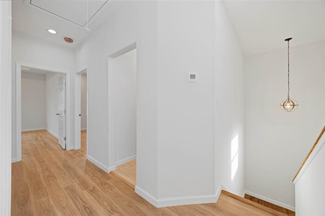 8923 De Priest St, Houston, TX 77088 - hallway featuring attic access and light wood-style flooring